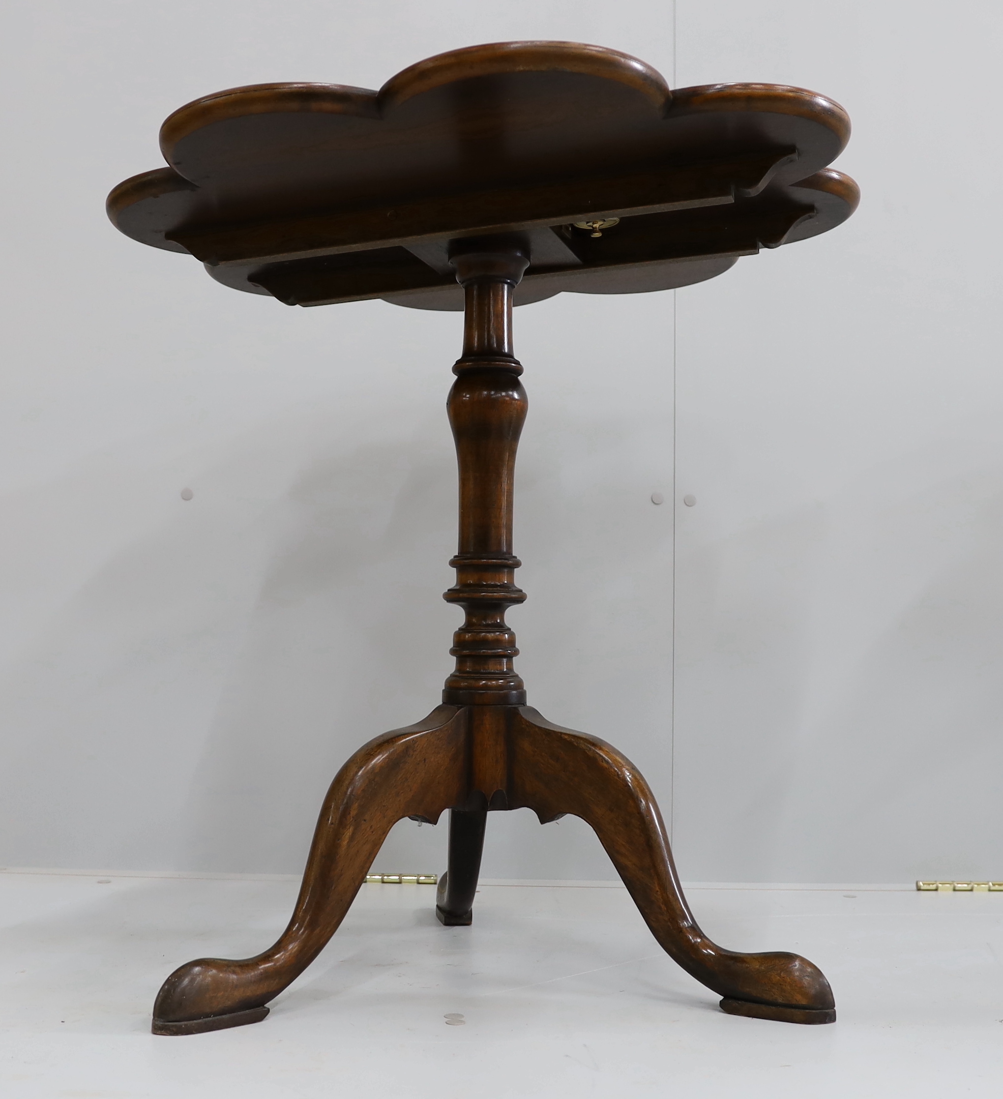 A pair of reproduction George III style mahogany and bird's eye maple tilt top tripod tea tables, width 68cm, height 69cm